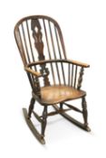 A 19TH CENTURY ASH AND ELM WINDSOR ROCKING CHAIR