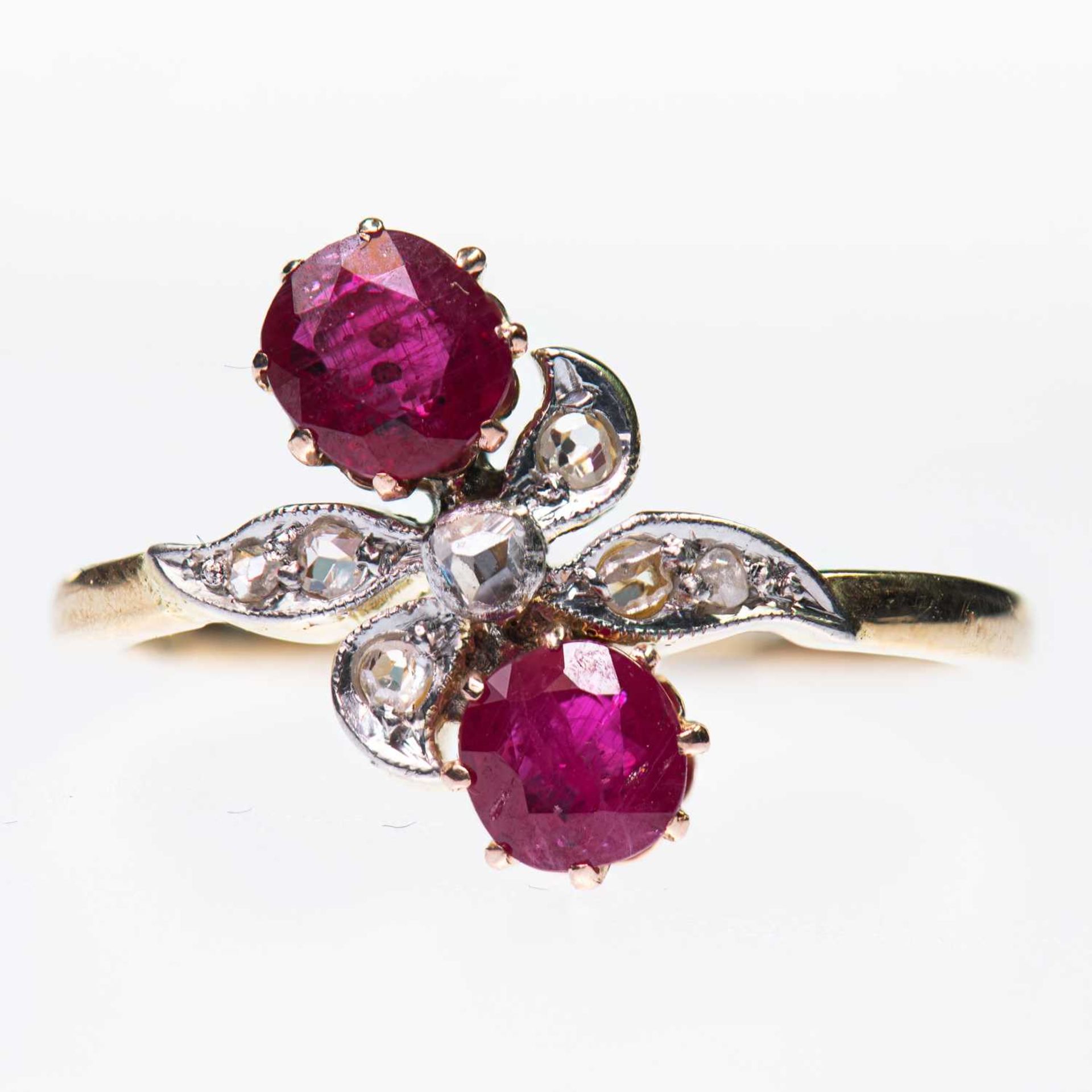 A RUBY AND DIAMOND CROSSOVER RING