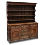 A 19TH CENTURY OAK DRESSER AND RACK