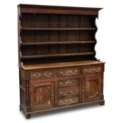 A 19TH CENTURY OAK DRESSER AND RACK