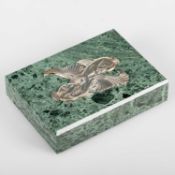 A SILVER AND GREEN MARBLE PAPERWEIGHT