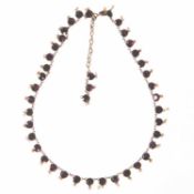 A GARNET AND SEED PEARL NECKLACE