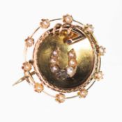 A LATE 19TH CENTURY DIAMOND AND SEED PEARL NOVELTY EQUESTRIAN BROOCH
