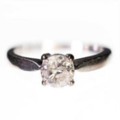 AN 18 CARAT WHITE GOLD SOLITAIRE DIAMOND RING