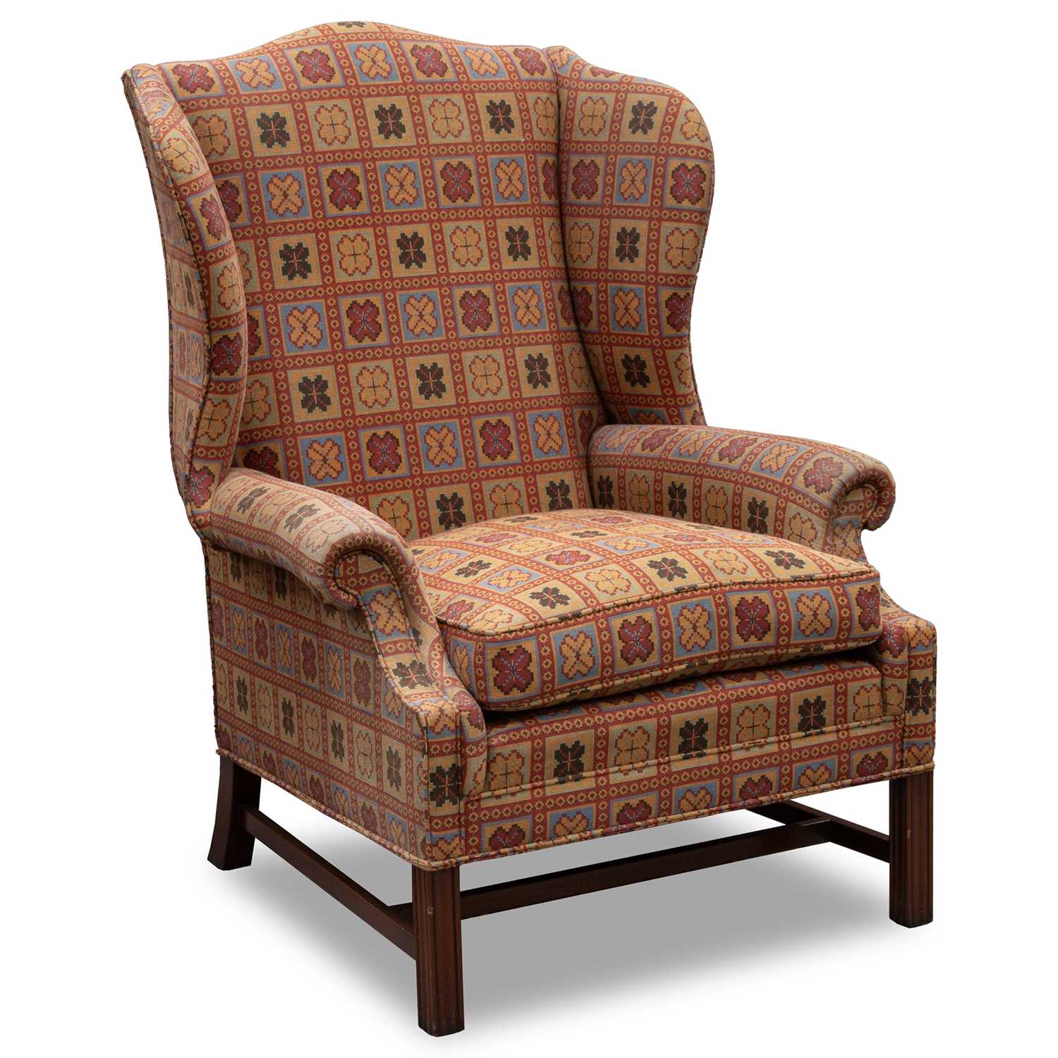 A GEORGIAN STYLE WING-BACK ARMCHAIR