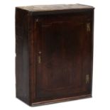 AN 18TH CENTURY OAK SPICE CUPBOARD