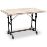 A CAST IRON AND COMPOSITE STONE-TOP TABLE