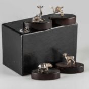 PATRICK MAVROS: A SET OF FOUR STERLING SILVER PLACE CARD HOLDERS