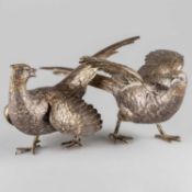 A PAIR OF CONTINENTAL CAST SILVER TABLE MODELS OF PHEASANTS