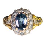 A SAPPHIRE AND DIAMOND CLUSTER RING