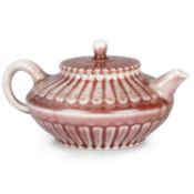 A JUN-TYPE COPPER-RED PORCELAIN TEAPOT AND COVER