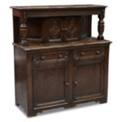 AN EARLY 20TH CENTURY OAK COURT CUPBOARD