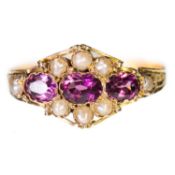 A VICTORIAN 15 CARAT GOLD GARNET AND SEED PEARL CLUSTER RING