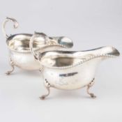 A PAIR OF GEORGIAN STYLE SILVER SAUCEBOATS