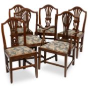 A SET OF SIX GEORGE III PROVINCIAL OAK DINING CHAIRS