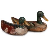 A PAIR OF PAINTED WOODEN DECOY DUCKS
