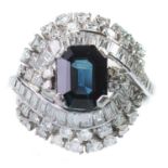 A SAPPHIRE AND DIAMOND CLUSTER RING