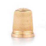 A 15 CARAT GOLD THIMBLE