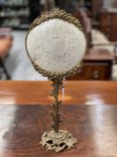 A 19TH CENTURY GILT-BRASS AND MOTHER-OF-PEARL TABLE SCREEN