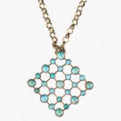A TURQUOISE PENDANT ON CHAIN