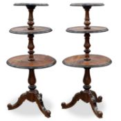 A PAIR OF VICTORIAN EBONISED AND WALNUT DUMB WAITERS, IN THE AESTHETIC TASTE