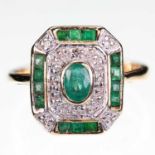 A 14 CARAT GOLD EMERALD AND DIAMOND CLUSTER RING