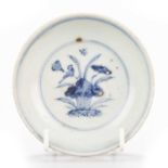 A CHINESE BLUE AND WHITE HOLE BOTTOM DISH, MING 15TH CENTURY