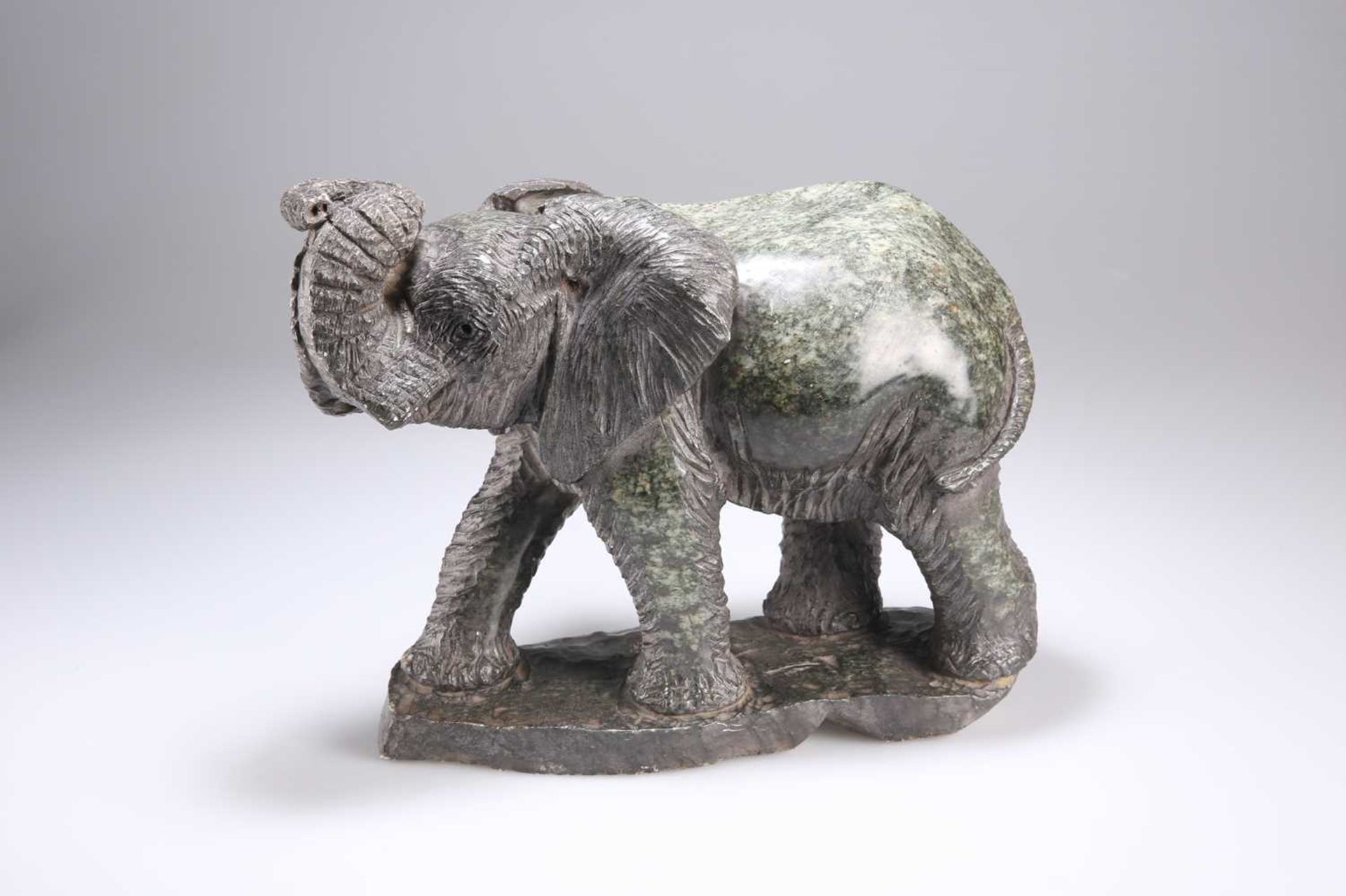 A SERPENTINE CARVING OF AN ELEPHANT