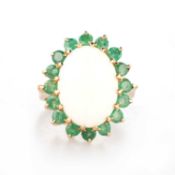 A 9 CARAT GOLD OPAL AND EMERALD CLUSTER RING