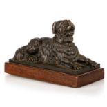 A PATINATED BRONZE OF A GOLDEN RETRIEVER