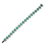 AN EMERALD AND DIAMOND CLUSTER BRACELET