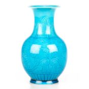 A CHINESE TURQUOISE GLAZED SGRAFFITO DECORATED VASE