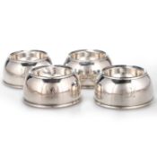 A SET OF FOUR GEORGE I BRITANNIA STANDARD SILVER TRENCHER SALTS