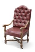 A 19TH CENTURY LEATHER UPHOLSTERED OAK ARMCHAIR