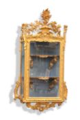 A LOUIS XV STYLE GILDED HANGING VITRINE