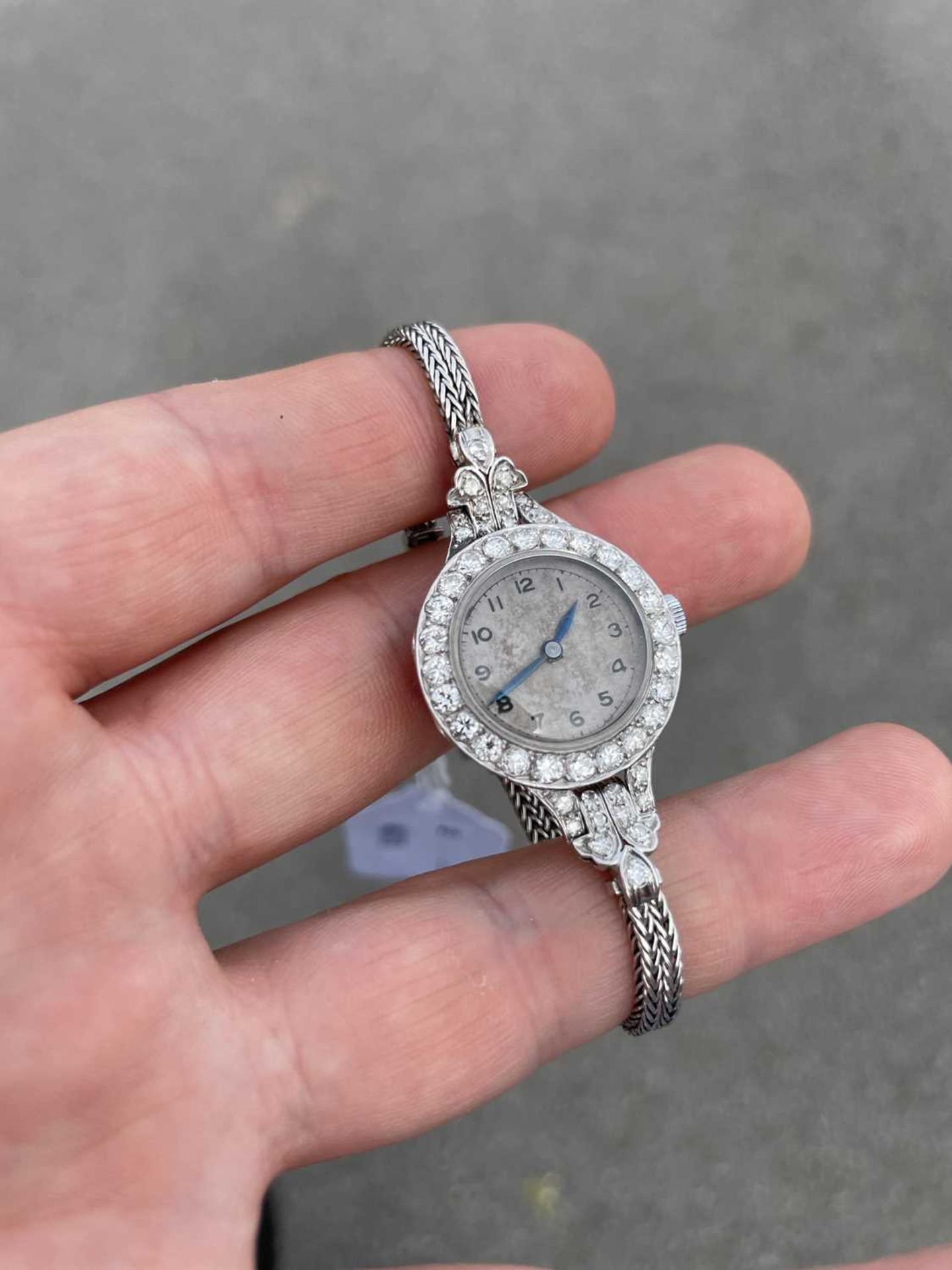 A LADY'S PLATINUM AND 9CT GOLD DIAMOND-SET BRACELET WATCH - Image 4 of 4