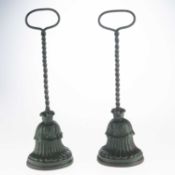 A PAIR OF 19TH CENTURY GREEN-PAINTED CAST IRON DOOR PORTERS, BY ARCHIBALD KENRICK & SONS, CIRCA 1880