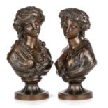 A PAIR OF 19TH CENTURY BRONZE BUSTS OF BACCHANTE AND FLORA
