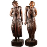 A VERY LARGE PAIR OF CHINESE CARVED HUANGHUALI FIGURES
