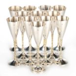 STUART DEVLIN: A SET OF TWELVE SILVER AND SILVER-GILT CHAMPAGNE FLUTES