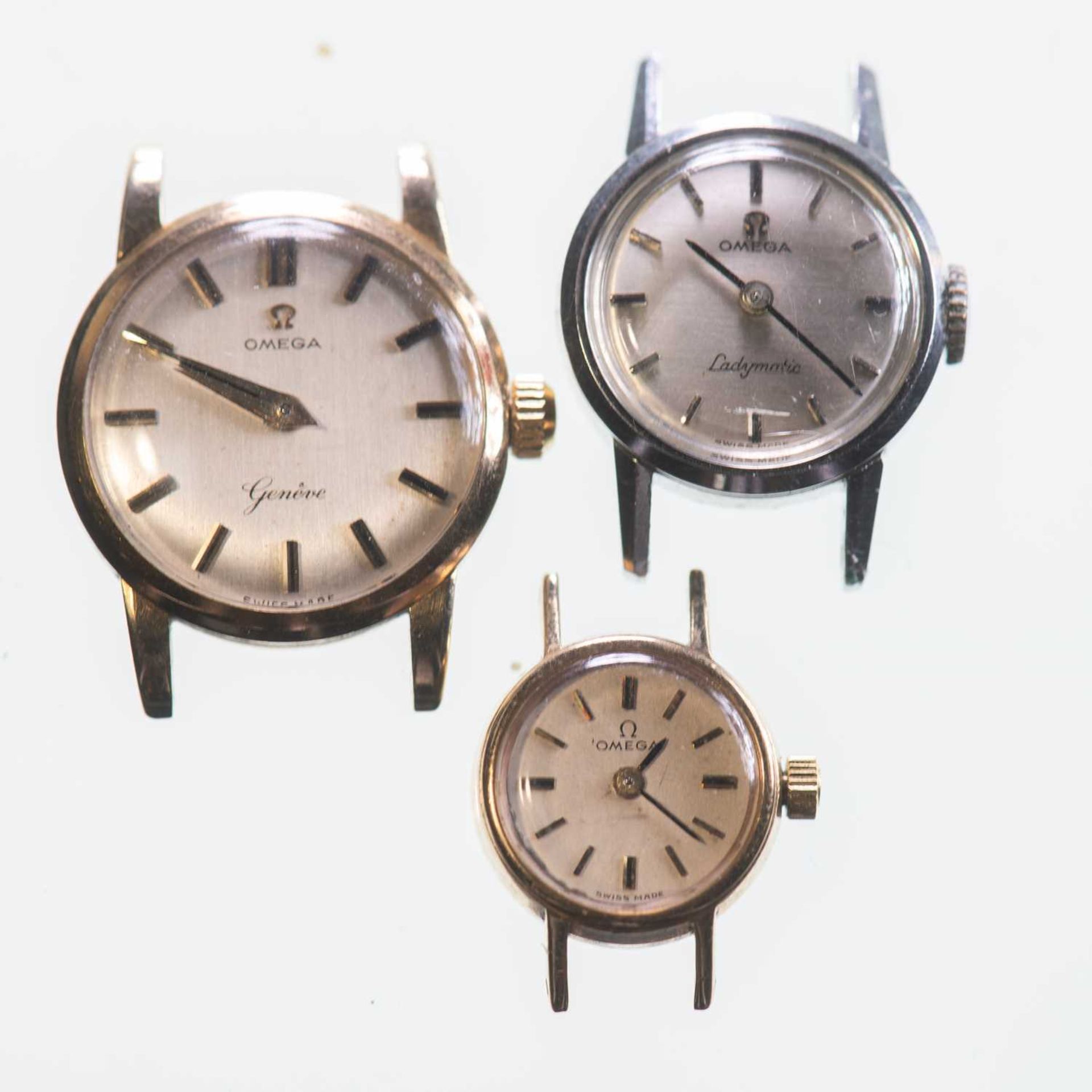 A TRIO OF LADY'S OMEGA WATCH HEADS