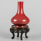 A CHINESE SANG DE BOEUF BOTTLE VASE, QING DYNASTY