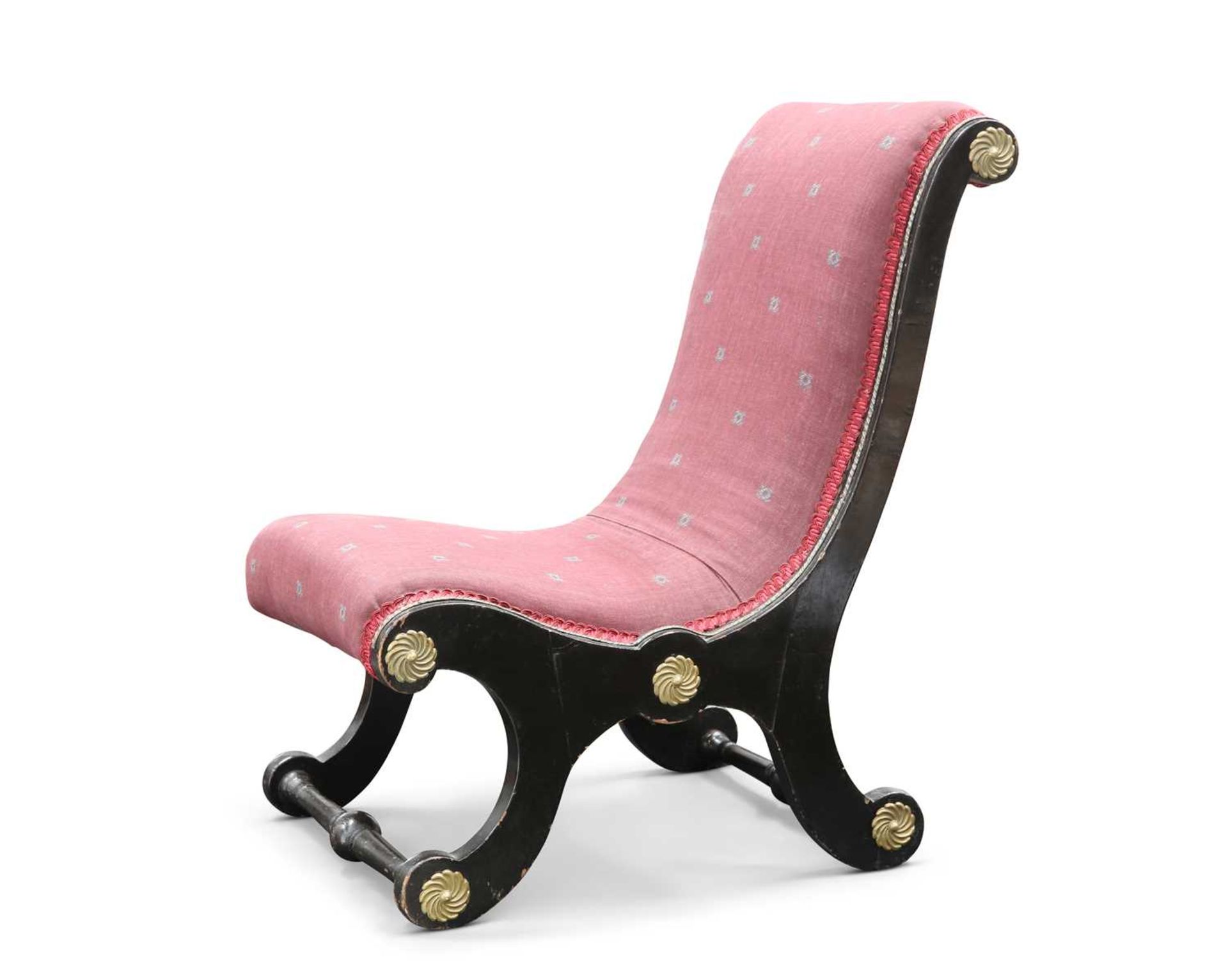 A 19TH CENTURY EBONISED SLIPPER CHAIR