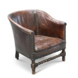 A 1920'S LEATHER UPHOLSTERED OAK TUB CHAIR