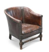 A 1920'S LEATHER UPHOLSTERED OAK TUB CHAIR