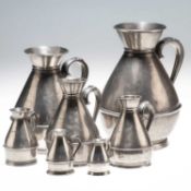 A GROUP OF SEVEN PEWTER MEASURES