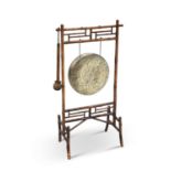 AN AESTHETIC BAMBOO AND BRASS DINNER GONG, LATE 19TH CENTURY