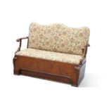 AN UNUSUAL WALNUT AND UPHOLSTERED SETTLE