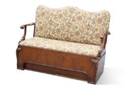 AN UNUSUAL WALNUT AND UPHOLSTERED SETTLE