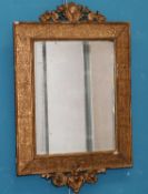 AN EARLY 19TH CENTURY GILT-GESSO WALL MIRROR